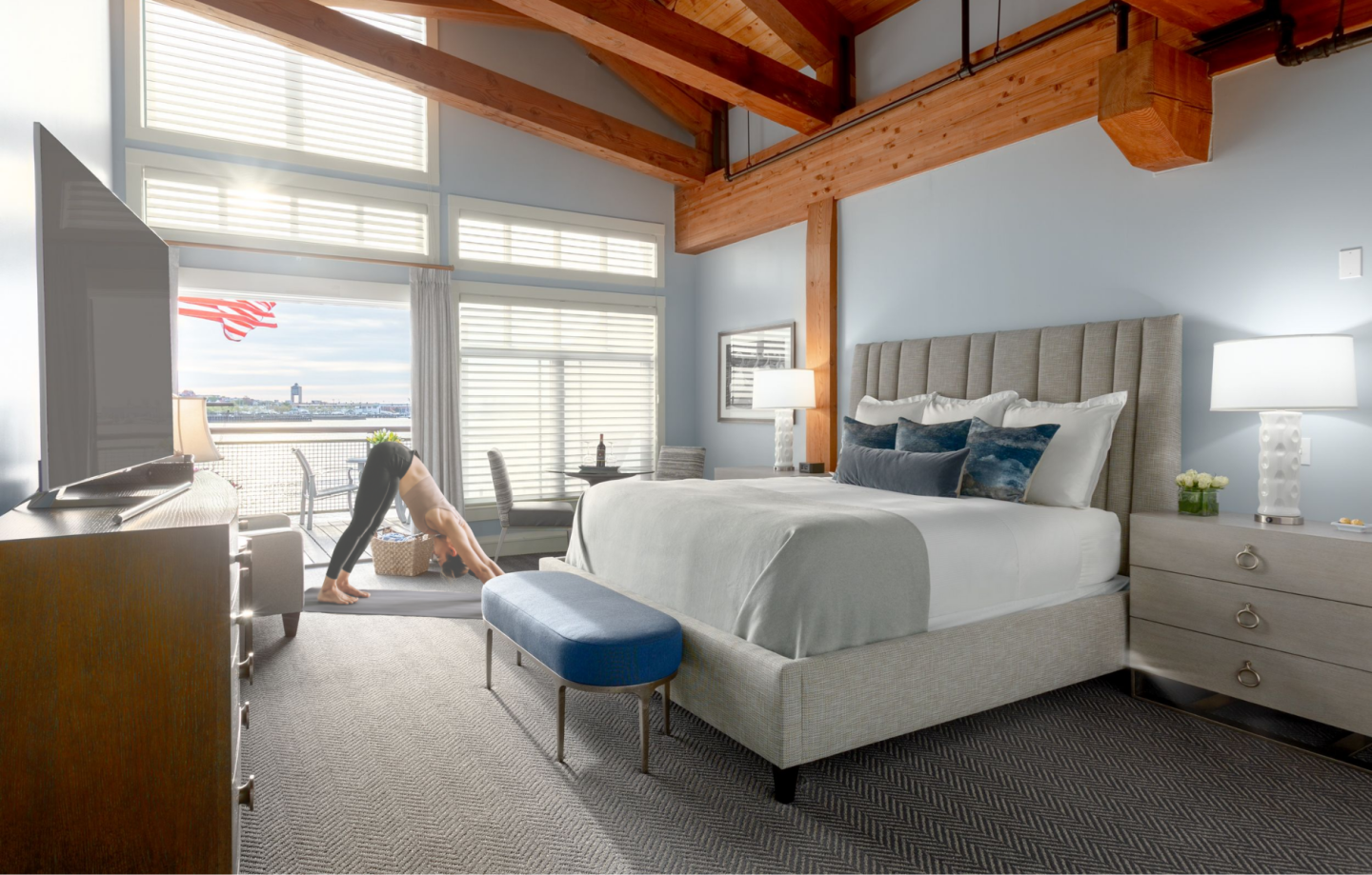 Inn guest practicing yoga in their room