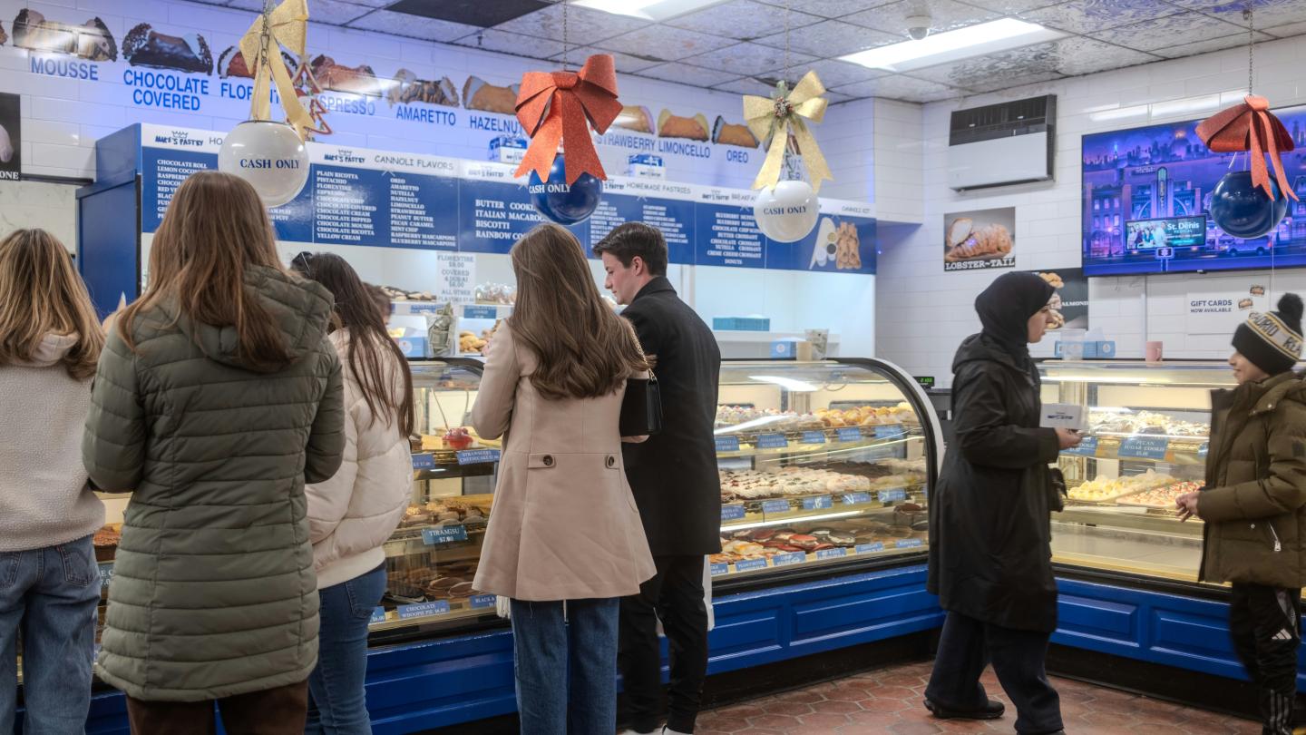 Tourists peruse the selection at Mike's Pastry